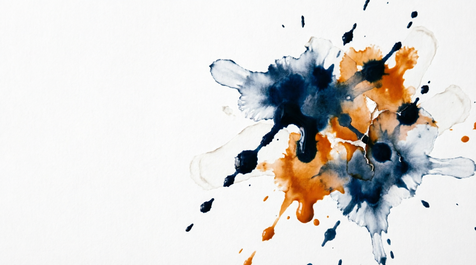 Blue and gold paint splatter on a white background